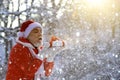 Merry Christmas and happy holidays. Portrait of happy Santa Claus walking in snowy forest and Blowing Magic Christmas Royalty Free Stock Photo