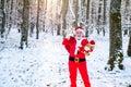 Merry Christmas and happy holidays. Santa on Christmas Eve is carrying presents to children in a red bag. Royalty Free Stock Photo