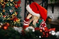 Merry Christmas and Happy Holidays. Surprised cute child girl opening present. Royalty Free Stock Photo