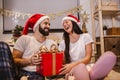 Attractive young couple is celebrating holiday at home together Royalty Free Stock Photo