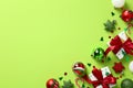 Merry Christmas and Happy New Year background. Gift boxes, baubles, Xmas decorations, confetti on pastel green background. Flat Royalty Free Stock Photo