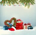 Merry Christmas and Happy New Year background with heart shaped Christmas tree branches, colorful gift boxes Royalty Free Stock Photo