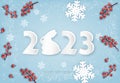 Merry Christmas and Happy New Year background with a 2023 letters, red berries and snowflakes. Year of the Rabbit concept. Royalty Free Stock Photo