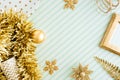 Merry christmas and happy new year background.top view of sparkling gold tinsel,ball,ornament decorate on green strip line table.