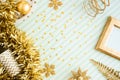 Merry christmas and happy new year background.top view of sparkling gold tinsel,ball,ornament decorate on green strip line table.