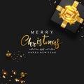 Merry Christmas and Happy New Year banner. Gift box decorated with gold bow- ribbon, Christmas balls, Golden confetti, Sparkling. Royalty Free Stock Photo