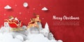 Merry Christmas and Happy New Year, Christmas banner postcard of Santa Claus on a sleigh in the village Royalty Free Stock Photo