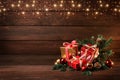 Merry Christmas and Happy New Year. Boxes with gifts, Christmas toys and fir branches on a wooden background Royalty Free Stock Photo