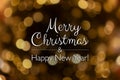 Merry Christmas and happy new year card. Blurry bokeh gold abstract background