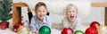 Merry Christmas or Happy New Year. Caucasian children friends celebrating Christmas or New Year. Excited boy and girl playing at