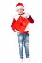 Merry christmas. Happy New Year. Caucasian young schoolboy in Santa costume holds a red Christmas box