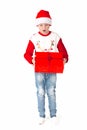 Merry christmas. Happy New Year. Caucasian young schoolboy in Santa costume holds a red Christmas box