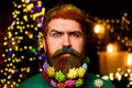 Merry Christmas and Happy new year. Christmas beard decoration. Serious bearded man with decorated beard. Bearded man Royalty Free Stock Photo