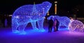 Merry Christmas and Happy New Year! Christmas in the city park. Christmas tree and illumination, luminous figures