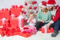 Merry Christmas and Happy new year for christmas family. Happy family by the Christmas tree. Father mother with his Royalty Free Stock Photo