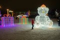 Merry Christmas and Happy New Year! Christmas in the city park. Christmas tree and illumination, luminous figures