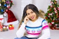 Merry Christmas, Happy New Year. Closeup african american young woman at home on Christmas Eve background, gift boxes, presents. Royalty Free Stock Photo