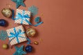 Merry Christmas and Happy New Year concept with gift boxes, snowflakes and blue decorations on modern background. Top view, flat