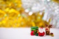 Merry Christmas and Happy New Year concept. Resin or Ceramic Santa Claus and friend standing on white soft floor.