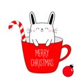 Merry Christmas Happy New Year. Cute bunnny in red cup of coffee tea. Candy cane. Xmas ball. Funny kawaii doodle animal. Line Royalty Free Stock Photo