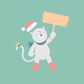 merry christmas and happy new year with cute cat holding blank sign in the winter season green background Royalty Free Stock Photo