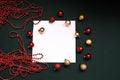 Merry Christmas and Happy New Year Decoration. Red and gold Bauble on Christmas black background. Winter time. Space for Royalty Free Stock Photo