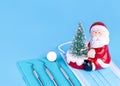 Merry Christmas And Happy New Year From Dentist Set of Dental Tools And Santa Claus On Blue Background. Royalty Free Stock Photo