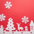 Merry Christmas and Happy New Year. Foam cutter of City with snow flake, art and craft style on red color paper Royalty Free Stock Photo