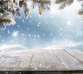 Christmas and happy new year greeting background with table .Winter landscape with fir tree