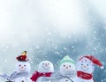 Merry christmas and happy new year greeting card with copy-space.Happy snowmen standing in winter christmas landscape.Snow