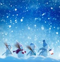 Many snowmen standing in winter Christmas landscape. Royalty Free Stock Photo