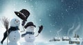 Two snowmen standing in winter Christmas landscape. Royalty Free Stock Photo