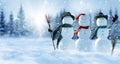 Merry Christmas and happy New Year greeting card with copy-space.Many snowmen standing in winter Christmas landscape.Winter