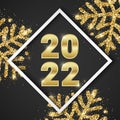 2022 Merry Christmas and Happy New Year greeting card design with shiny golden numbers and gold glitter snowflakes on Royalty Free Stock Photo