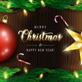 Merry Christmas and Happy New Year greeting card with gold Christmas lettering and festive elements such as Christmas tree decorat Royalty Free Stock Photo