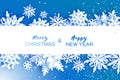 Merry Christmas and Happy New Year Greetings card. White Paper cut snowflakes. Origami Winter Decoration background