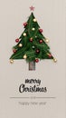 Merry Christmas and happy new year greetings in vertical top view cardboard with natural eco decorated christmas tree