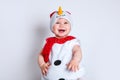 Merry christmas and happy new year. happy baby in snowman costume Royalty Free Stock Photo