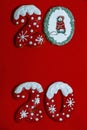 Merry Christmas and Happy New Year 2020, new year holiday  gingerbread cookies on the red background Royalty Free Stock Photo