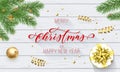 Merry Christmas and Happy New Year holiday golden decoration and calligraphy font for greeting card on white wooden background. Ve Royalty Free Stock Photo