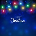 Merry Christmas and happy new year holiday greeting card. Colourful xmas lights. Glowing lights on blue background. Glowing Royalty Free Stock Photo