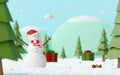 Merry christmas and Happy New Year, Landscape of Snowman in pine forest celebrate with Christmas gift on a snowy ground