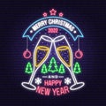 Merry Christmas and 2022 Happy New Year neon sign with glasses of champagne and christmas tree, ball, snowflakes. Vector Royalty Free Stock Photo