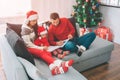 Merry Christmas and Happy New Year. Picture of adults drawing with pencils in colouring book. They are concentrated