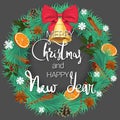 Merry Christmas and Happy New Year. A festive pine wreath with oranges, cinnamon and a beautiful bell with a bow Royalty Free Stock Photo