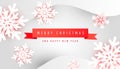 Merry Christmas and Happy New Year poster card with minimalistic red ribbon and paper cut snowflakes on gray background with place Royalty Free Stock Photo