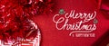 Merry christmas and happy new year red text background.top view of tinsel,gift box,ball,ribbon decorate on sparkling table.holiday Royalty Free Stock Photo