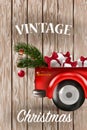 Merry Christmas and Happy New Year with red truck and christmas tree. Royalty Free Stock Photo