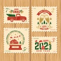Merry Christmas and Happy New Year 2023 retro postage stamp with Santa Claus, Christmas tree, gifts, pickup. Vector