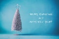 Merry Christmas. Happy New Year. Retro postcard. Retro style. New Year tree on a blue background